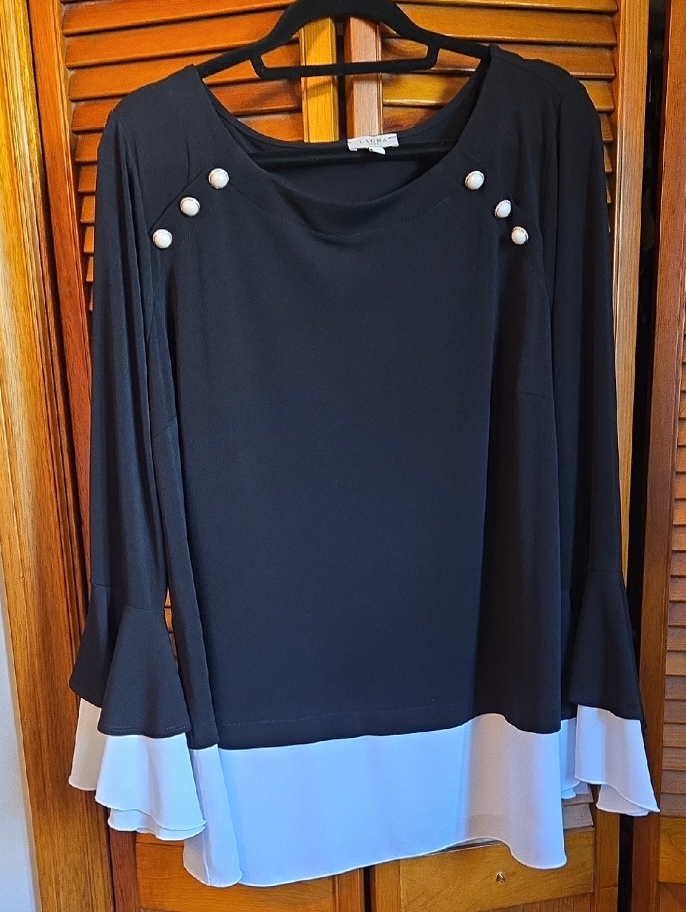 Black Blouse with White Layered Hem and Pearl Shoulder Buttons